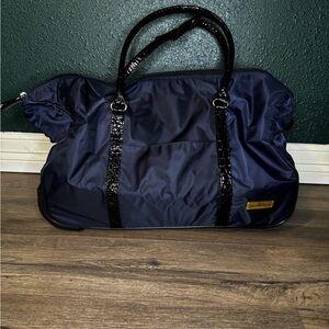 Samantha Brown Rolling Duffle-  Travel Bag with Black Accents